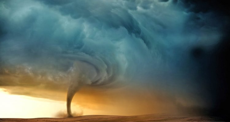 A tornado forming in the evening from a supercell