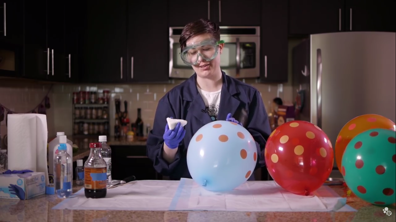 Popping a balloon using orange juice