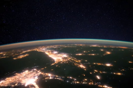 Why does Earth appear to glow from space?