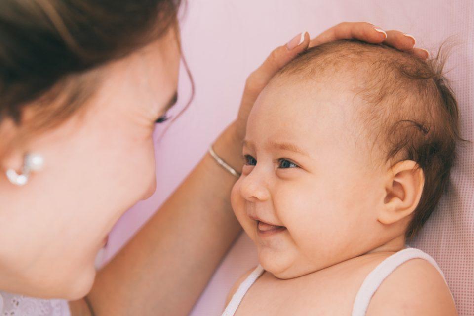 Smiling babies are responding to their parents, expert says
