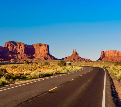 Empty scenic highway in Monument Valley, Arizona, USA