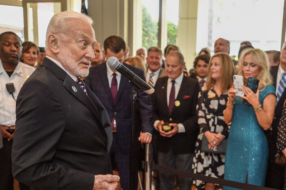 Buzz Aldrin get animated as he talks about the United States returning to the Moon after touring the Apollo 11