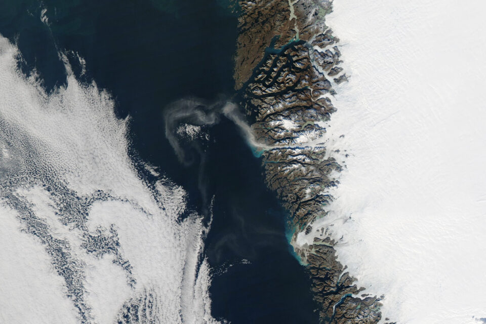 Large dust plumes stream off the coast of Greenland
