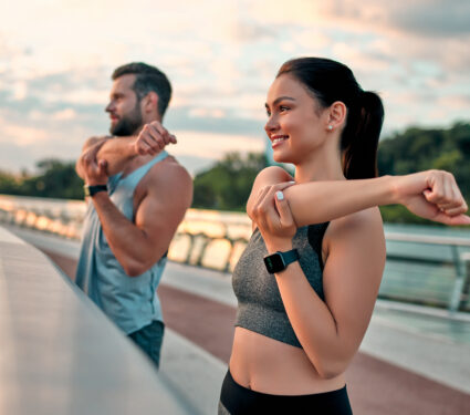 Couple,Stretching,Outdoors,Before,Morning,Run.,Handsome,Bearded,Man,And