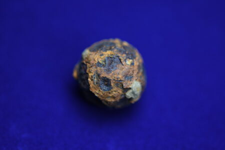 Micrometeorites,On,A,Blue,Background