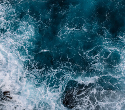 Aerial,View,To,Ocean,Waves.,Blue,Water,Background