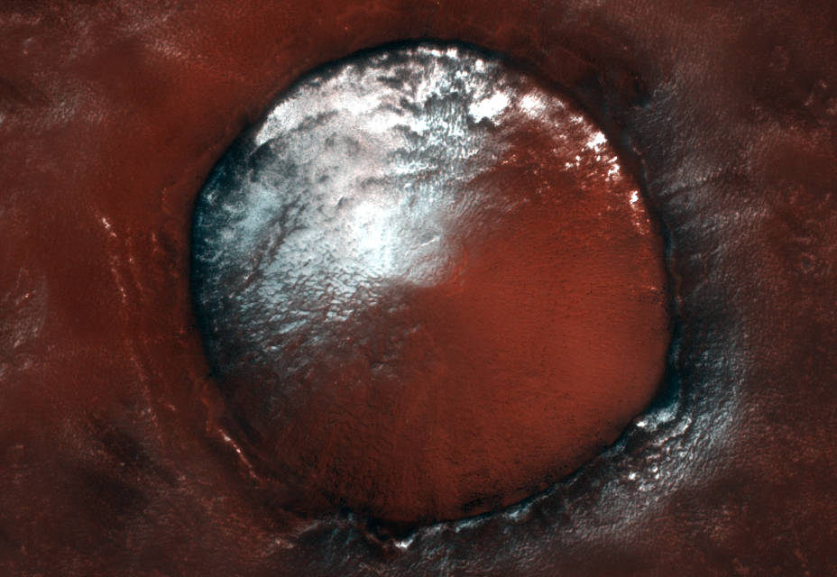 White water-ice against the rusty red soil of Mars