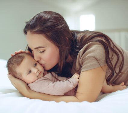 A,Young,Mother,Is,Holding,Her,Newborn,Baby.,Mother,Of
