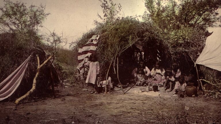Chiricahua Apache medicine man with his family