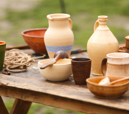 Rustic,Old,Medieval,Wooden,Dining,Table,With,Antique,Pottery