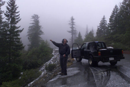 BIGFOOT 2/C/17JAN99/SC/MAC           Bigfoot chaser John Freitas.  Freitas along Jawbone Rd. in Six Rivers Nat'l Forest, holds a microphone to record, hopefully Bigfoot  calls in the area. Freitas uses a hugh speaker on his pick-up truck to blast recorded