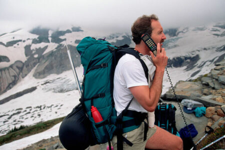 Climber Talking on Cellular Phone on Mountain