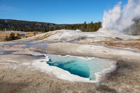2022/01/spring-and-geyser-at-Yellowstone-768w.jpg