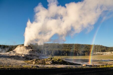 2022/01/geyser-with-rainbow-at-Yellowstone-768w.jpg
