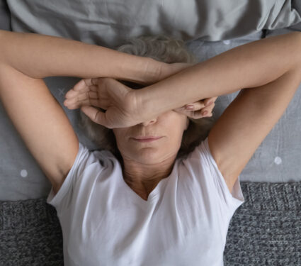 Top,View,Aged,Woman,Lying,On,Bed,Woke,Up,At