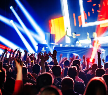 Nightclub,Dj,Rave,Party,With,Crowd,Of,People,Hands,Up