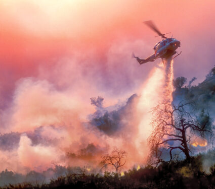 A,Helicopter,Dropping,Water,On,A,California,Wildfire,In,Rugged