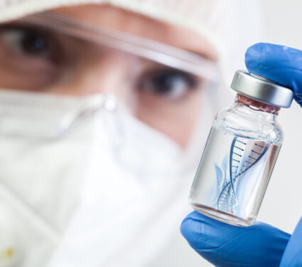 Female,Nhs,Uk,Lab,Microbiologist,Biotechnician,Holding,Glass,Bottle,Vial