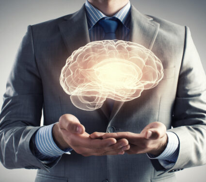Close,Up,Of,Businessman,Holding,Digital,Image,Of,Brain,In