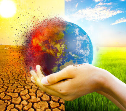Hand,Of,Young,Man,Hold,World,Globe,With,Burn,Hot