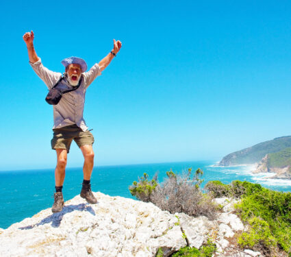 Happy,Jumping,Old,Man,Against,Beach,Background.,Shot,On,The