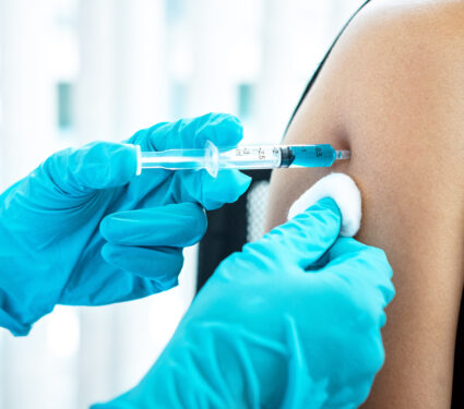 Doctor,Making,A,Vaccination,Into,Patient,With,Needle,Getting,Immune