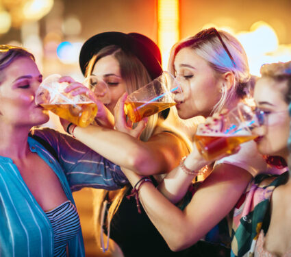 Female,Friends,Drinking,Beer,At,Music,Festival