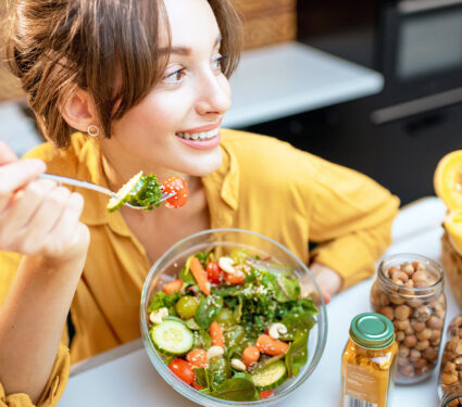 Portrait,Of,A,Young,Cheerful,Woman,Eating,Salad,At,The
