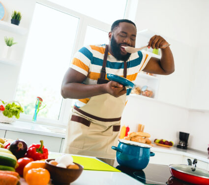 Photo,Of,Young,Cheerful,Guy,Good,Mood,Cooking,Dinner,Taste
