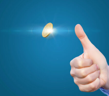 Hand,Throws,A,Coin,To,Make,The,Decision.