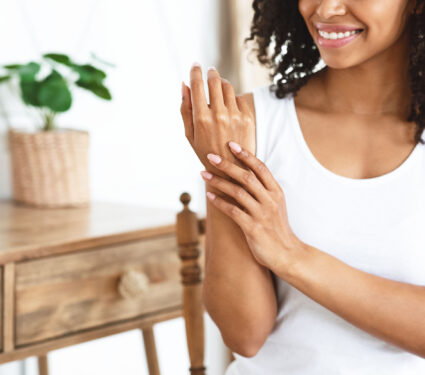 Anti-aging,Hand,Care.,Smiling,African,Woman,Touching,Her,Soft,Body