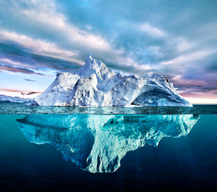 Iceberg,With,Above,And,Underwater,View,Taken,In,Greenland