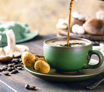 Trendy,Superfood,Mushroom,Coffee,Is,Pouring,In,Green,Cup,On