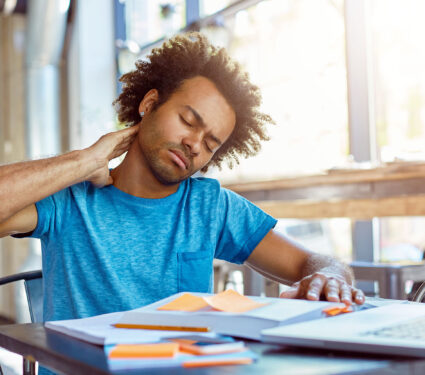 Picture,Of,Tired,Unhappy,Dark-skinned,University,Student,Rubbing,Neck,Because