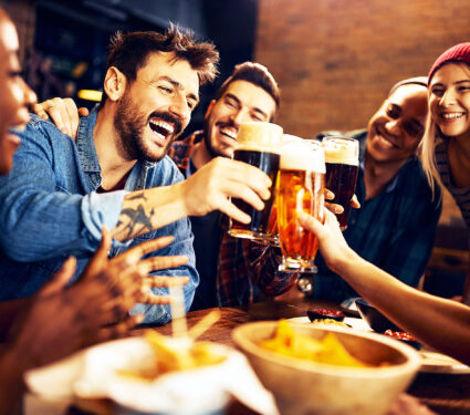 Multiracial,Group,Of,Happy,Friends,Having,Fun,While,Toasting,With