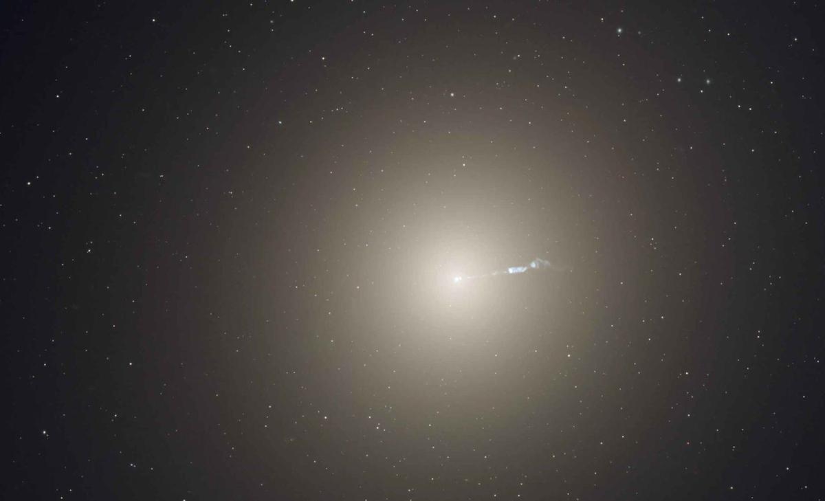Supermassive black hole captured in an unexpected spin shift