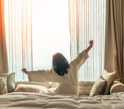 Hotel,Relaxation,On,Lazy,Day,With,Asian,Woman,Waking,Up