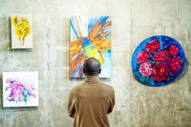 Back,View,Of,African,Male,Guest,Of,Art,Gallery,Standing