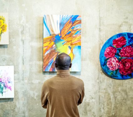 Back,View,Of,African,Male,Guest,Of,Art,Gallery,Standing