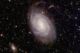 Young stars illuminate a spiral galaxy in the constellation Pavo