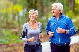 Smiling,Senior,Couple,Jogging,In,The,Park