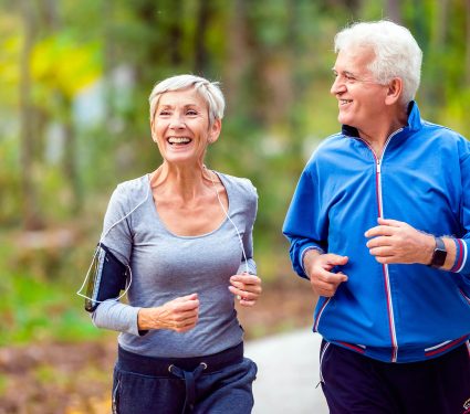 Smiling,Senior,Couple,Jogging,In,The,Park