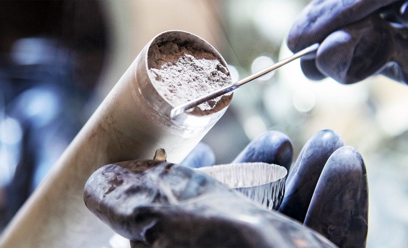 Signatures of an exotic element discovered when retesting Apollo moon samples