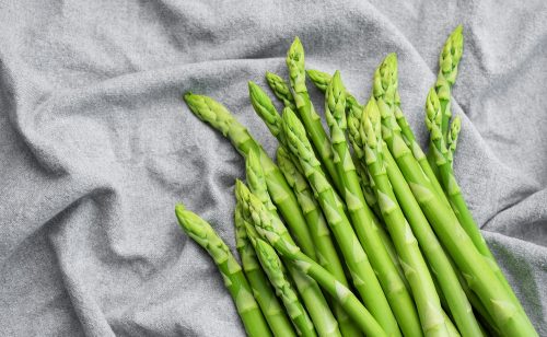Fresh,Green,Asparagus,On,Grey,Textile,Background.,Flat,Lay