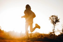 Silhouette,Of,A,Kenyan,Runner,Running,Along,A,Red,Dirt