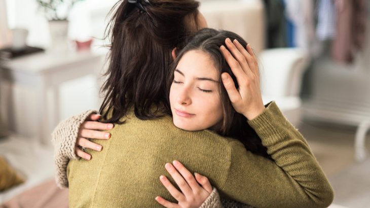 Why warm hugs and skin cues strengthen our sense of identity