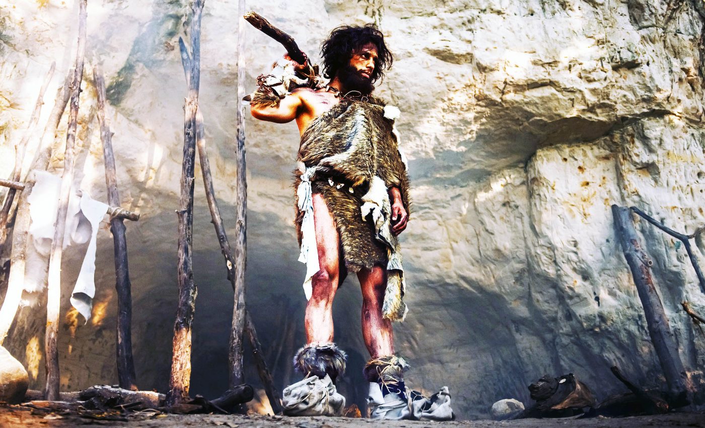 When did early humans first start wearing clothes, and why?