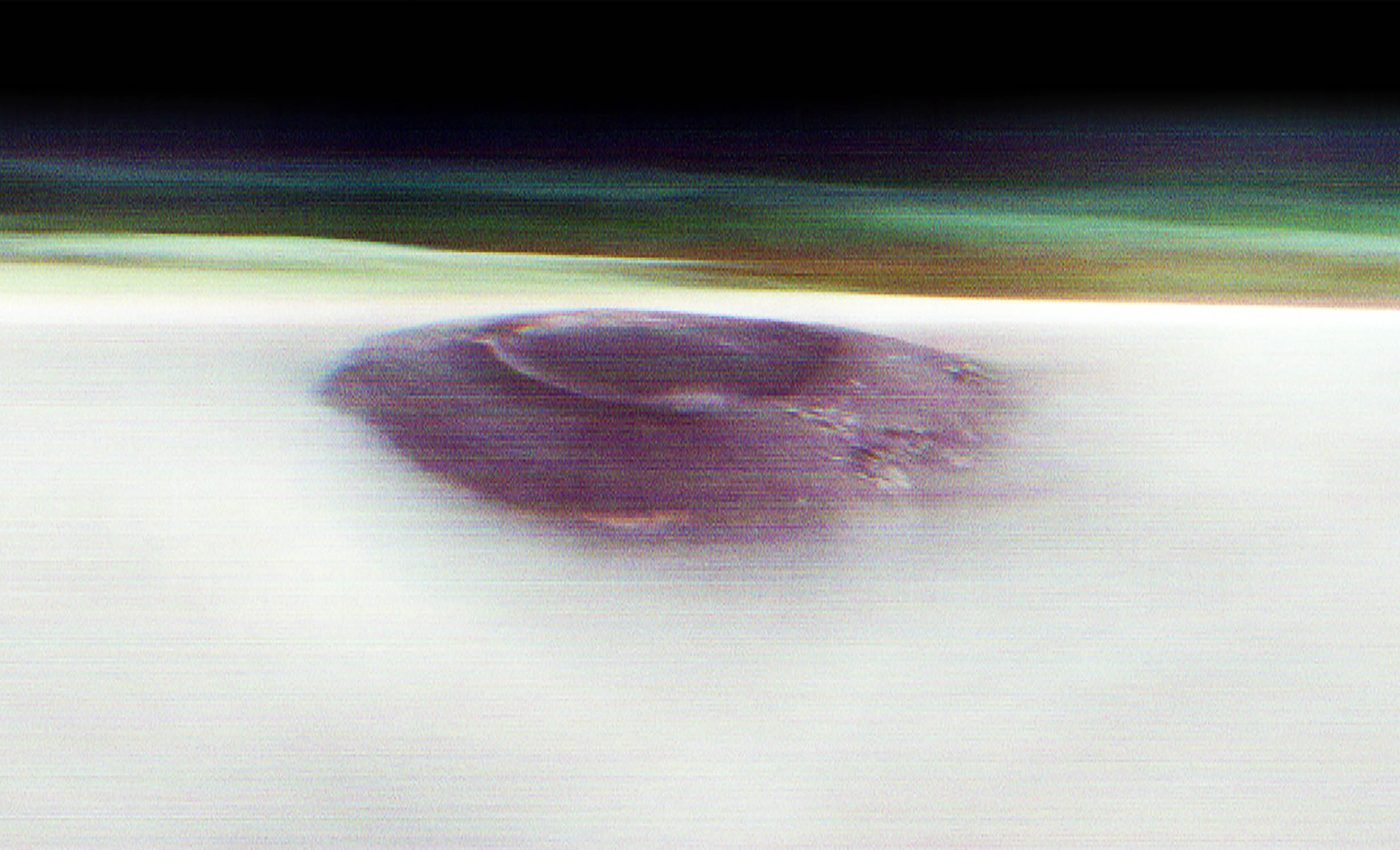 Mars volcano captured with its head above the clouds in sunrise photo