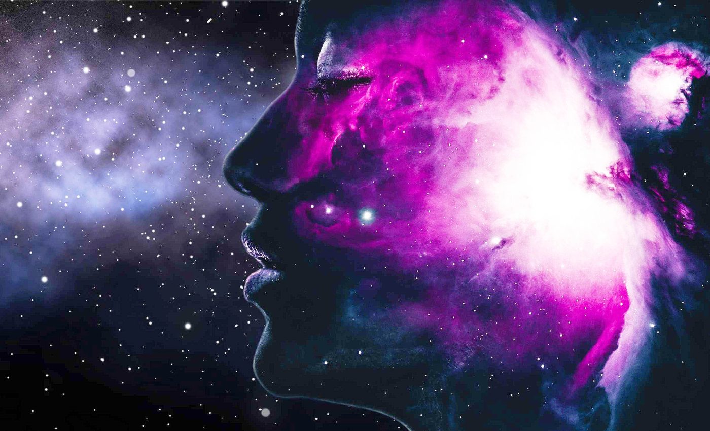 A picture of a galaxy overlayed with a face.