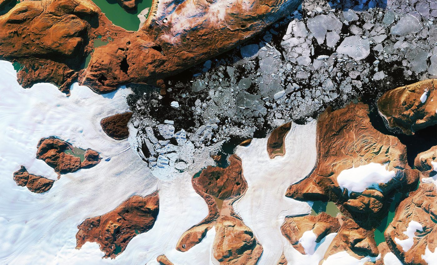 Hidden lake explodes under the Greenland ice sheet, creating a massive crater